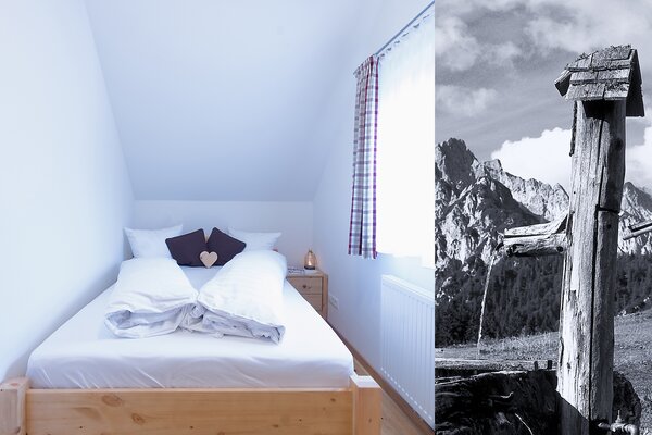 Gemütliches Schlafzimmer der Ferienwohnung Vorderhorn mit Holz-Doppelbett unter einer Dachschräge in Lofer.